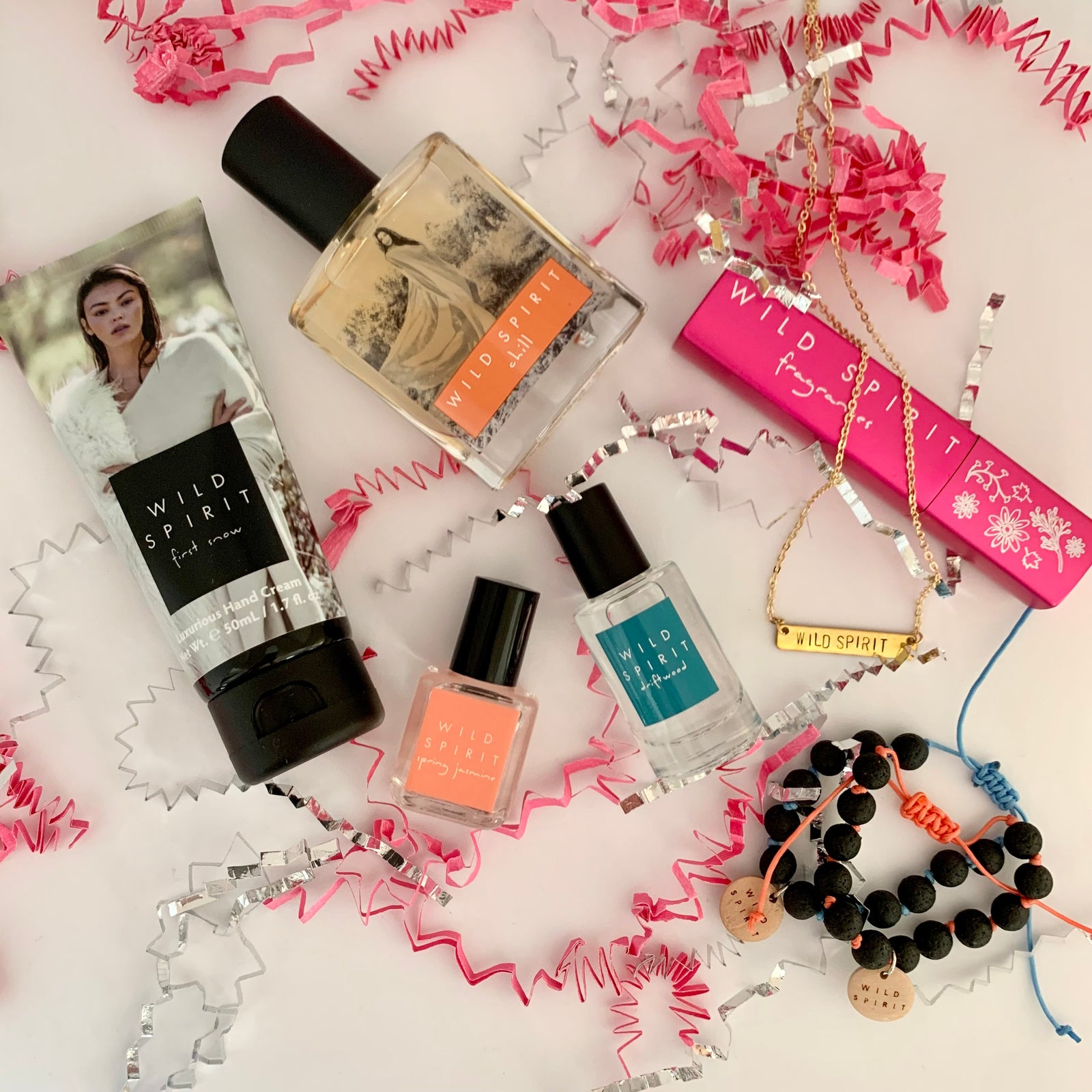 Whether a sweet, floral, fresh, or bold perfume lover, this kit has a little bit of everything and is full of mix and matching potential. Satisfy your sweet tooth with our best-selling Chill perfume, feel flirty on the go with a Rosy Glow Atomizer, keep hands moisturized with our First Snow Hand Cream, enjoy breezy florals with a Spring Jasmine Rollerball, stay fresh with a Driftwood Body Splash, and accessorize with our beautiful Wild Spirit Bar Necklace and two lava bead bracelets.